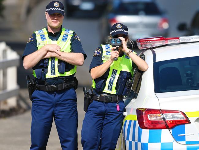 Easter Road Operation - Patrick Billings story. Constable Brooke Johnson and Constable John Barwick of Tasmania Police checking driver's speed on the Brooker Highway at New Town. PICS: MATT THOMPSON