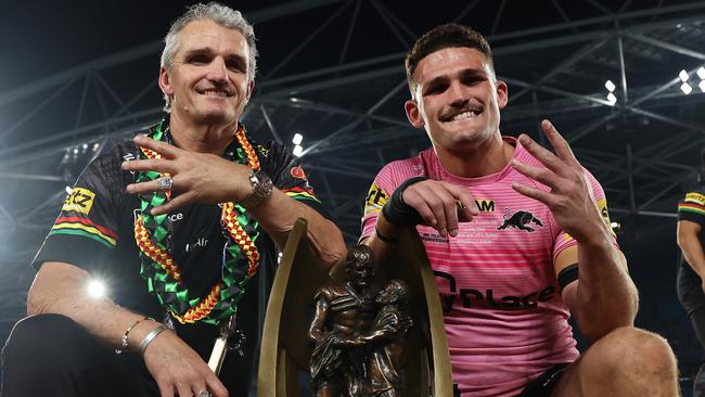 SYDNEY, AUSTRALIA - OCTOBER 06:  Nathan Cleary (R) of the Panthers poses with the Provan-Summons Trophy alongside his father and coach Ivan Cleary after winning the 2024 NRL Grand Final match between the Melbourne Storm and the Penrith Panthers at Accor Stadium on October 06, 2024, in Sydney, Australia. (Photo by Cameron Spencer/Getty Images)