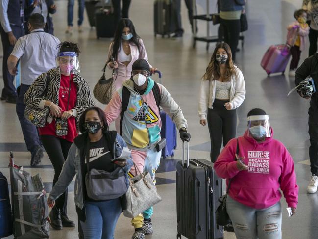 Face masks are mandatory on board. Picture: Getty Images/AFP