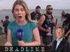 Cabana, towel... hookah pipe! Five star photobomb at beach TV live cross