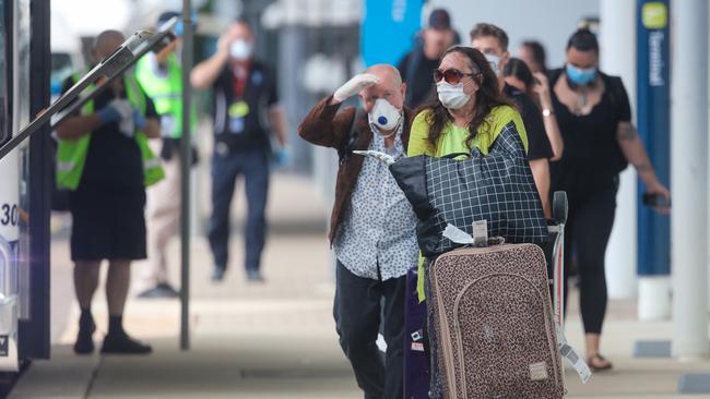 Travellers arrive at Darwin International Airport on April 2, the first day of quarantine for interstate arrivals into the NT. Picture Glenn Campbell