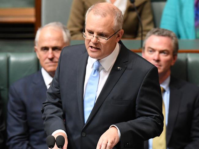 Federal Treasurer Scott Morrison hands down his third Federal Budget in the House of Representatives at Parliament House in Canberra, Tuesday, May 8, 2018. (AAP Image/Dean Lewins) NO ARCHIVING