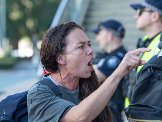 Anti-war protester on the steps of the Brisbane Convention and Exhibition Centre outside the Land Forces expo. Picture: Brad Fleet