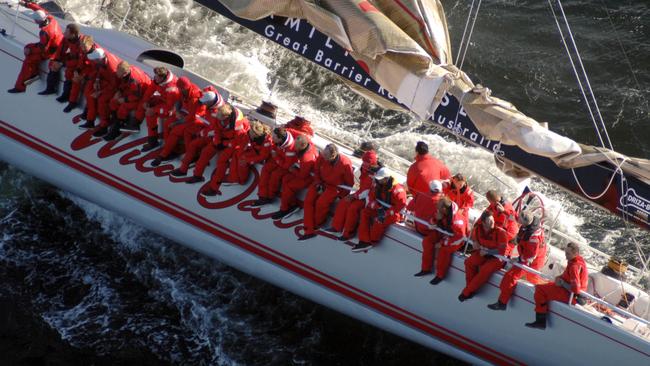 Wild Oats XI sails to the finish line in the Derwent River to set a new record for the Sydney to Hobart. Photo: Ian Mainsbridge.