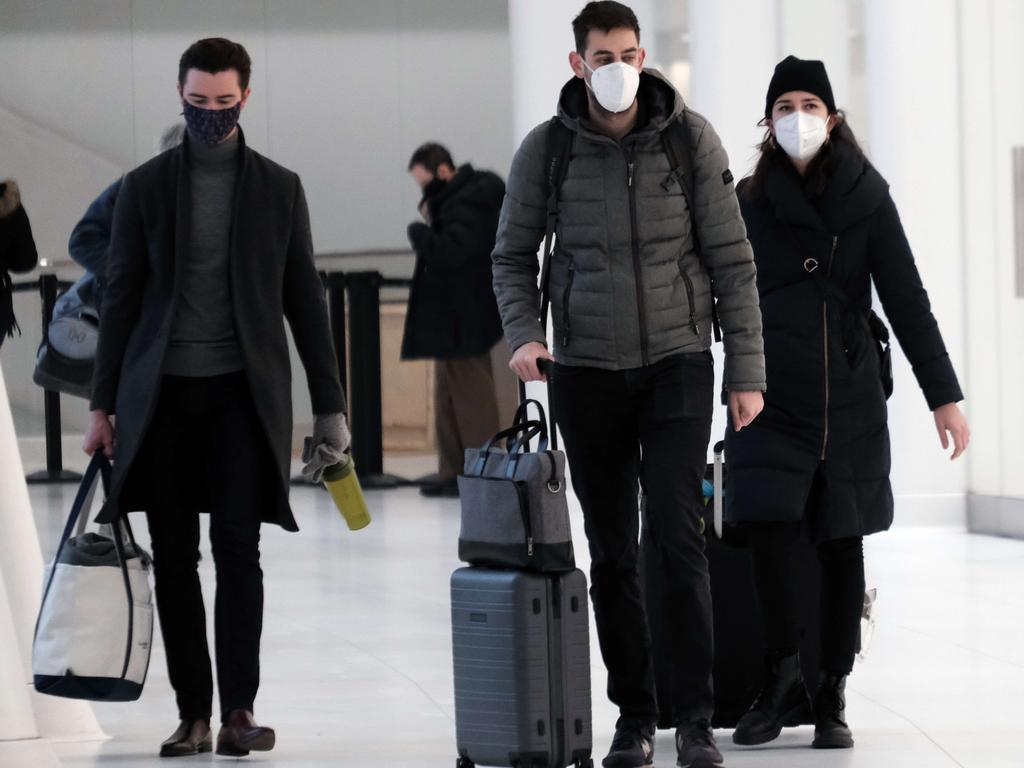 People wear masks at an indoor mall in The Oculus in lower Manhattan on the day that a mask mandate went into effect in New York. Picture: AFP