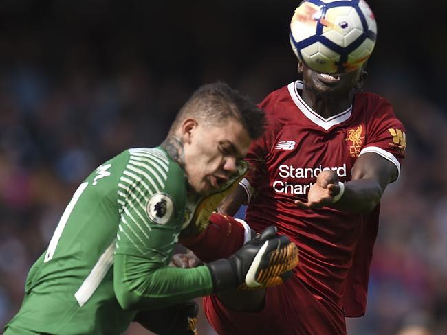 Sadio Mane challenges Ederson.