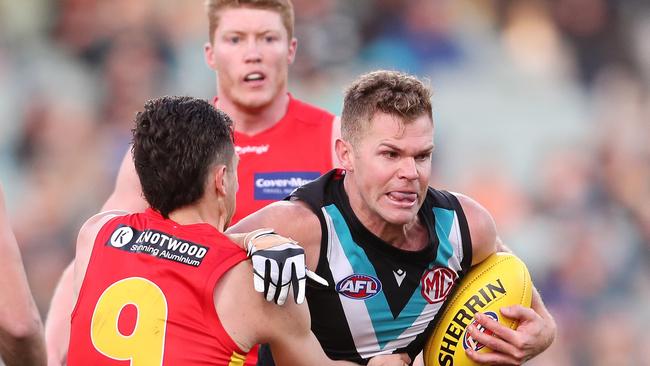 ADELAIDE, AUSTRALIA - JUNE 26: Dan Houston of the Power and Ben Ainsworth of the Suns during the 2022 AFL Round 15 match between the Port Adelaide Power and the Gold Coast Suns at the Adelaide Oval on June 26, 2022 in Adelaide, Australia. (Photo by Sarah Reed/AFL Photos via Getty Images)