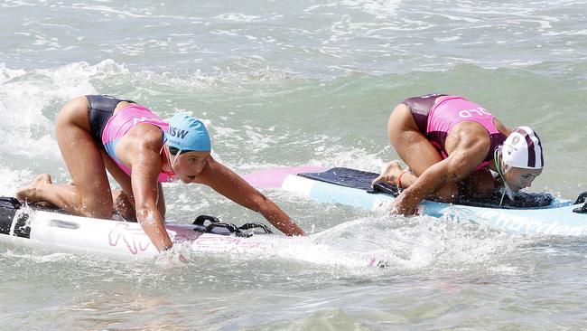 L to R: NSW's Piper Harrison and Queensland's Tiarnee Massie in the open ironwoman event.