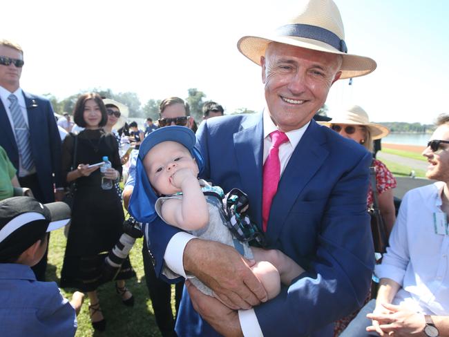 Malcolm Turnbull holding five-month-old John McCreanor at the 2018 Australia Day citizenship ceremony in Canberra, doubts the US will join the TPP. Picture Kym Smith