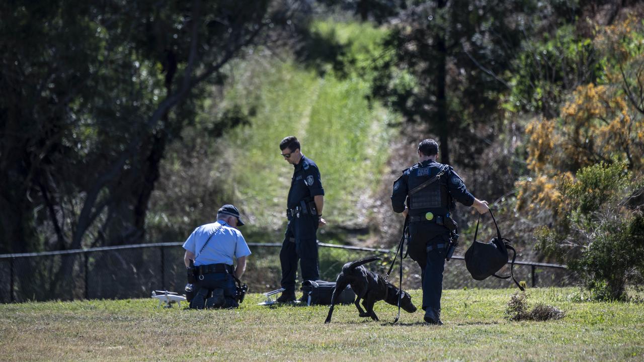 Police investigate the scene of the stabbing. Picture: Monique Harmer