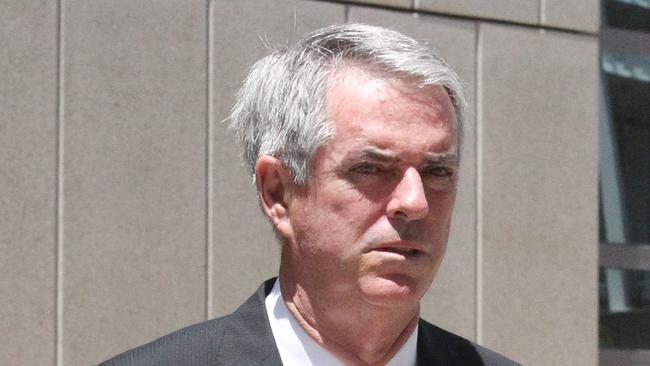 Disgraced financial planner Brad Sherwin leaves a Brisbane court.