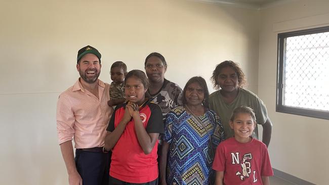 Supplied Editorial Chansey Paech with Francine Palmer (front centre) and her family in their new home