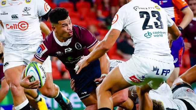 Hunter Paisami looks to offload against the Sharks. Picture: AFP