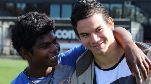 Maurice Jr with his cousin, Richmond’s Daniel Rioli.