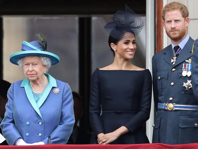 LONDON, ENGLAND - JULY 10: Queen Elizabeth II, Prince Harry, Duke of Sussex and Meghan, Duchess of Sussex on the balcony of Buckingham Palace as the Royal family attend events to mark the Centenary of the RAF on July 10, 2018 in London, England. (Photo by Chris Jackson/Getty Images)