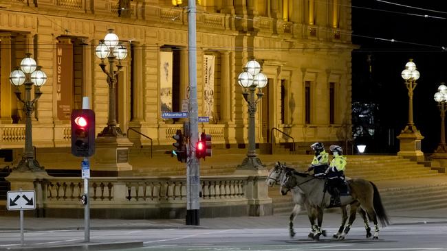 Police officers outside Parliament House on Monday night. Picture: David Geraghty