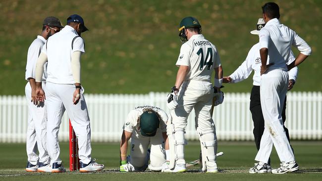 Concerned players surround Will Pucovski after the head knock. Picture: Getty Images