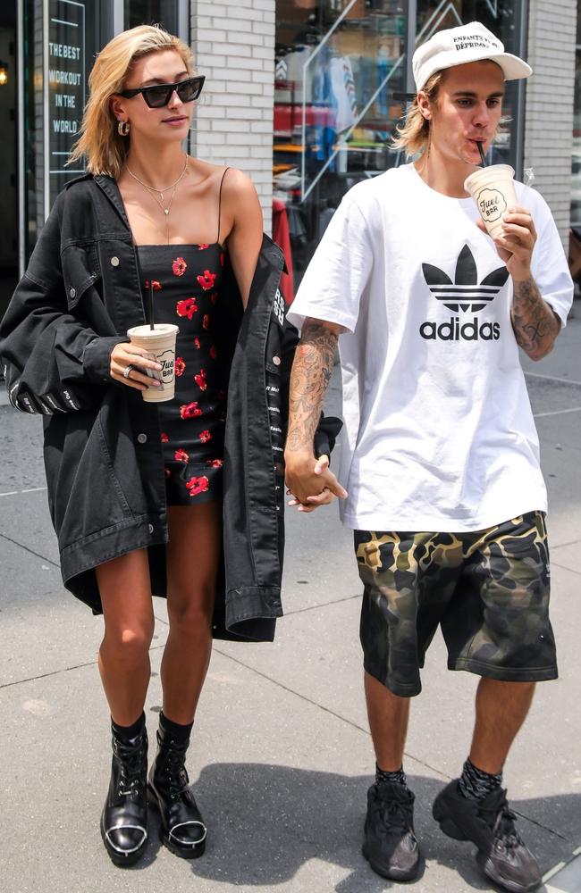 Hailey Bieber, pictured with husband Justin Bieber, wearing Bec and Bridge’s $280 Coco Cabana mini dress. Picture: BACKGRID