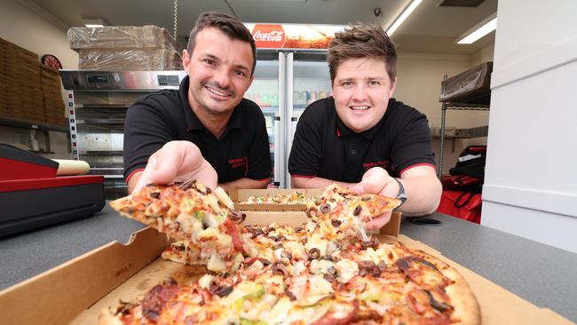 Merlins Pizza has been named the best on the Gold Coast. Co-owners Jordan Powell and Scott Jelich with some of their tasty treats. Picture Glenn Hampson