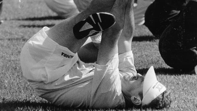 Allan Border stretches before a cricket match at Kahlin Oval in the early 1990s.