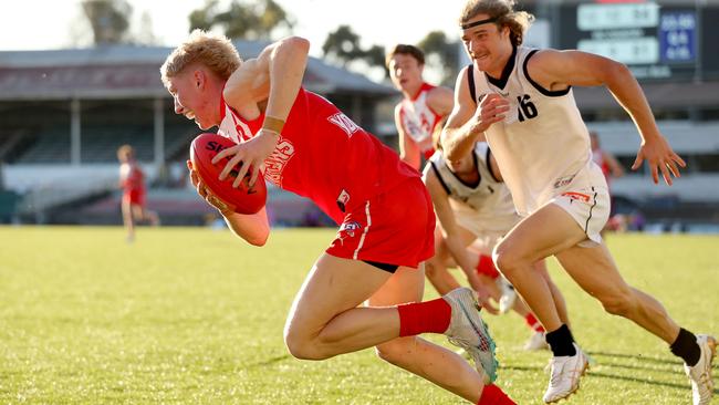 Ethan Stanley bursts away for the Young Guns. Picture: Kelly Defina/AFL Photos/via Getty Images