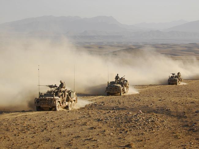 Australian Army soldiers from Special Operations Task Group drive in convoy in long-range patrol vehicles across an Afghanistan desert in northern Uruzgan province, Afghanistan.  (This image has been digitally altered for operational security.) *** Local Caption *** Australian Army soldiers from Special Operations Task Group (SOTG) along with Afghan Nation Security Forces conducted a counter-insurgency operation over several days in northern Uruzgan province, Afghanistan.  Operation Slipper is Australia's military contribution to international campaigns against terrorism, countering piracy in the Gulf of Aden, and maritime security. Under this operation, Australian forces contribute to the efforts of the NATO-led International Security Assistance Force in Afghanistan, aiming to bring security, stability and prosperity to the country and prevent Afghanistan again becoming a safe haven for international terrorists.   Australian forces are also contributing to the US-led International Coalition Against Terrorism efforts across the Middle East.  SOTG comprises personnel from 1st Commando Regiment, Special Air Service Regiment, 4th Battalion (Commando) of the Royal Australian Regiment, Incident Response Regiment, Special Operations Logistics Squadron and a variety of supporting units from the ADF. Picture: Department of Defence