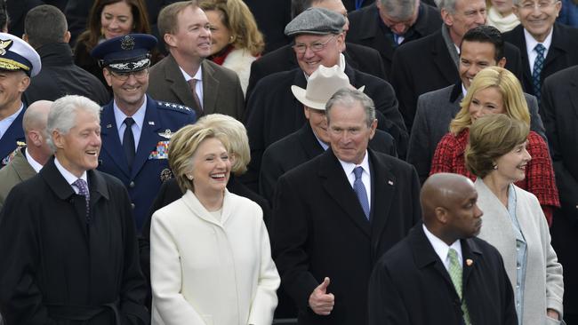 Former President George W. Bush, right, his wife Laura, Former Secretary of State Hillary Clinton and Former President Bill Clinton wait for the ceremony. Picture: AP