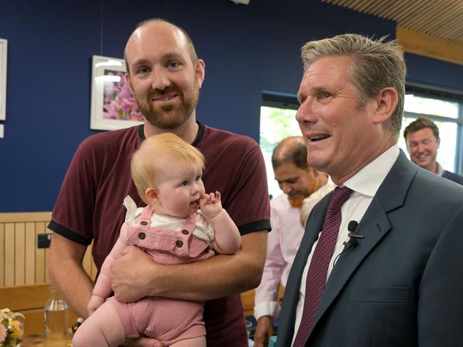 EXETER, ENGLAND - AUGUST 15: Labour Party leader Sir Keir Starmer meets Dave Church and 10 month old Ellen, at Park Life Heavitree community group cafe, to talk about Cost-Of-Living Crisis, on August 15, 2022 in Exeter, England. The Labour Party leader offered his proposal as the UK is experiencing rising inflation and a steep increase in the cost of gas and electricity. (Photo by Finnbarr Webster/Getty Images)