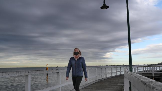 A woman gets her daily exercise at Port Melbourne on Monday. Picture: NCA NewsWire/David Crosling