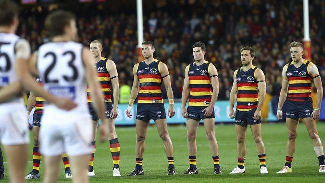 Crows adopt their power stance for the national anthem, a product of the club’s mind training program in 2017. Picture: Sarah Reed