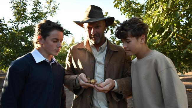 Mr Herrmann with his sons Kipling, left, and Barney at their farm. Picture: Noah Yim