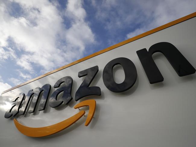 (FILES) In this file photo shows the Amazon logo at one of the company's centre in Bretigny-sur-Orge on November 28, 2019. - Jeff Bezos said February 2, 2021, he would give up his role as chief executive of Amazon later this year as the tech and e-commerce giant reported a surge in profit and revenue in the holiday quarter. (Photo by Thomas SAMSON / AFP)