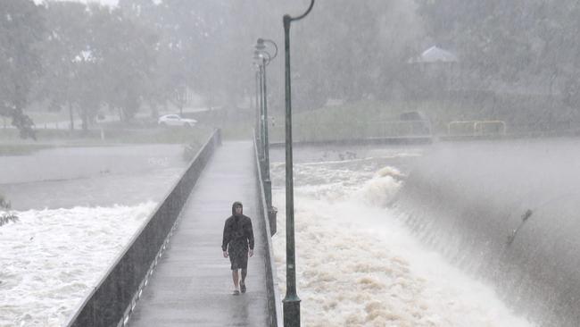 Heavy rain lashes Townsville causing flash flooding. Reiv Melick at Aplins Weir. Picture: Evan Morgan