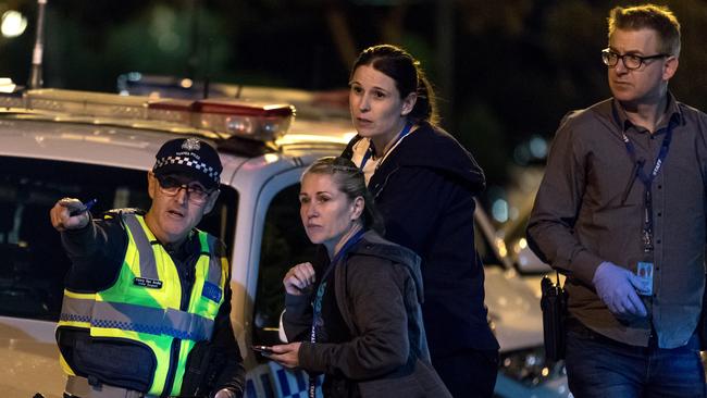 Police co-ordinate the scene at the entrance to the Melbourne Youth Justice Centre in Parkville. Picture: Mark Dadswell.