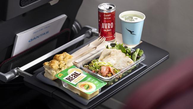 Qantas’ new look international economy meal service includes a “side” of cheese and crackers, or salad or dessert. Picture: Qantas