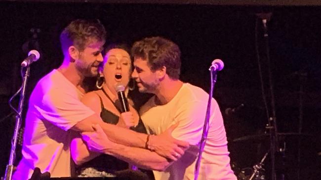 Chris Hemsworth, Celeste Barber and Liam Hemsworth on stage at the Beach Hotel in Byron Bay for the second day of the Make It Rain Fundraiser.