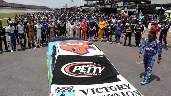 Bubba Wallace, driver of the #43 Victory Junction Chevrolet, walks around his car after NASCAR drivers pushed him to the front of the grid as a sign of solidarity with him after the noose was discovered. Picture: Chris Graythen/Getty Images/AFP