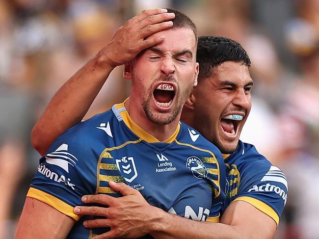 SYDNEY, AUSTRALIA - APRIL 18: Clinton Gutherson of the Eels celebrates scoring a try with team mate Dylan Brown of the Eels during the round six NRL match between the Parramatta Eels and the Wests Tigers at CommBank Stadium on April 18, 2022, in Sydney, Australia. (Photo by Cameron Spencer/Getty Images)