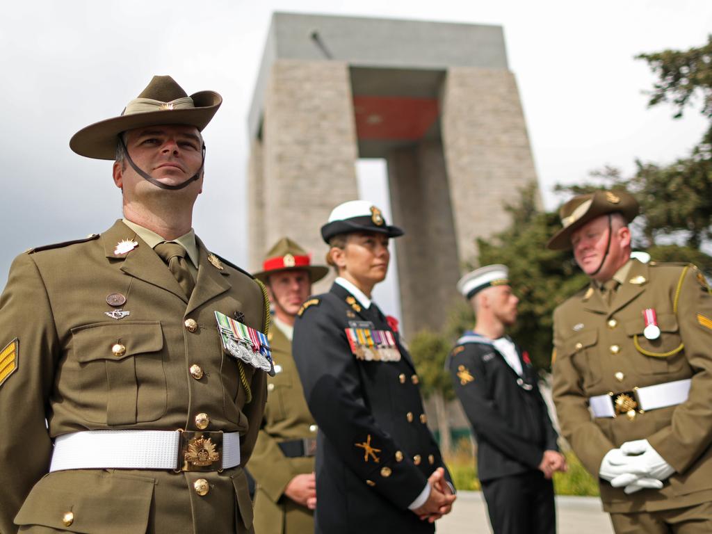 Australian and New Zealand service personnel pose before the commemoration of the 'Battle of Gallipoli' in front of the Turkish Mehmetcik Monument, in Gallipoli. Picture: Sahin Erdem