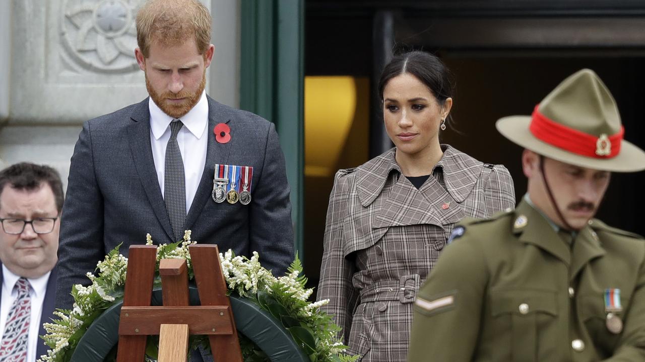 Prince Harry and Meghan, Duchess of Sussex in a moment of reflection at the Tomb of the Unknown Warrior in Wellington. Credit: AP Photo/Kirsty Wigglesworth