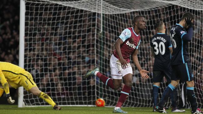 West Ham United's Ecuadorian striker Enner Valencia (3R) turns to celebrate.