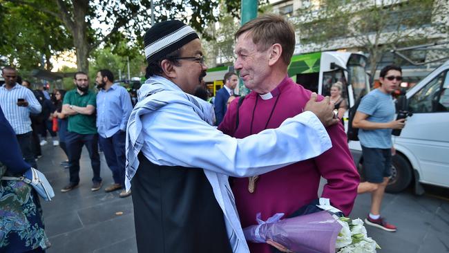 National Council of Churches in Australia president Bishop Philip Huggins meets Islamic Council of Victoria president Mohamed Mohideen at the vigil. Picture: Jason Edwards