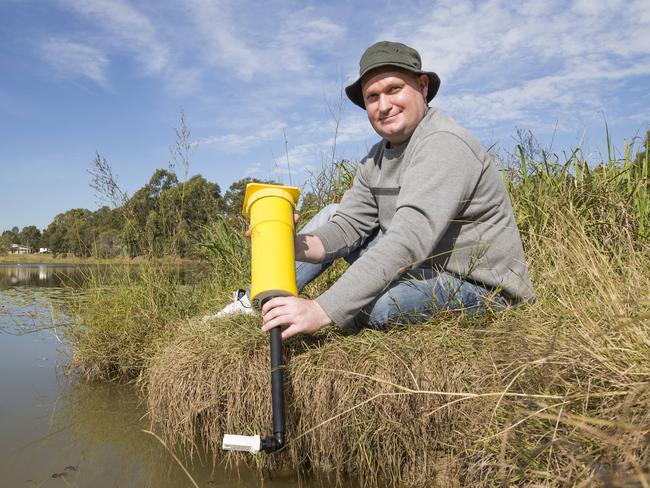 Logan City Council have provided an enviroGrant for a SEMAT deployment at Lake Ellerslie, Griffith Logan Campus.  Thurssday, June 14 2018. Co-creator of SEMAT Dr. Jarrod Trevathan poses for a photograph at Lake Ellerslie.   (AAP Image/Renae Droop)