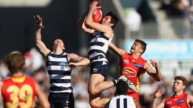 Jack Henry takes a high-flying mark.