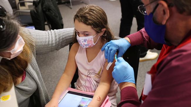 A child receives a Pfizer vaccination in America. Picture: Getty Images