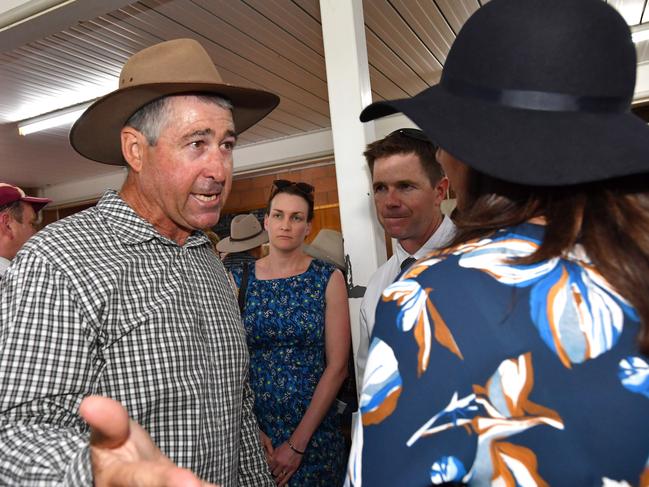 Local farmer Jim Hancock (left) is seen talking to Queensland Premier Annastacia Palaszczuk (right) at the Kumbia Race Club in Kumbia during the Queensland Election campaign on Tuesday, November 7, 2017. Premier Palaszczuk visited Kumbia which sits in the electorate of Nanango and is currently held by the LNP's deputy leader Deb Frecklington for the annual Kumbia Cup race day. (AAP Image / Darren England) NO ARCHIVING