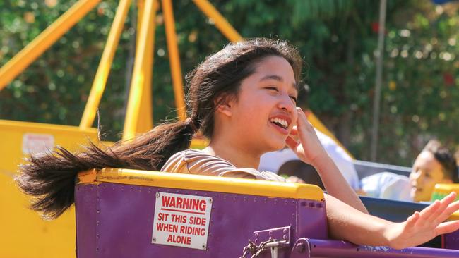 Charita Chau, 13, enjoying the third and final day of the Royal Darwin Show. Picture: Glenn Campbell