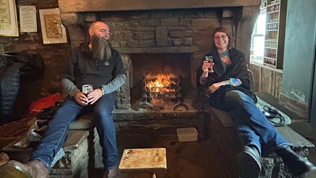 Paul and Fiona Wright enjoying a nip by the fire. Picture: Paul Wright