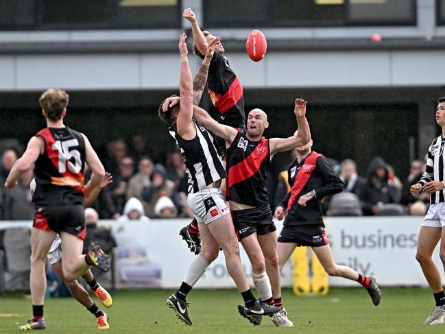 Riddell and Wallan players fly for the ball. Picture: Andy Brownbill