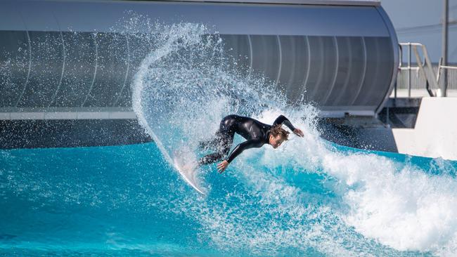 A board rider surfs at the UrbnSurf wave park in Melbourne. Picture: Jason Edwards